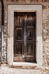 Old wooden italian door in a small village in Abruzzo