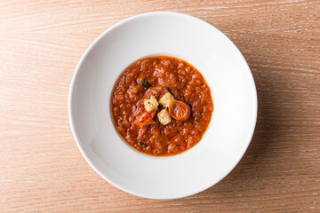 Italian Baked tomato gravy with toasted bread with beef tomato and salad