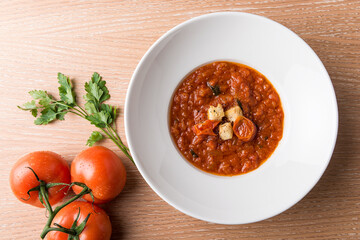 Italian Baked tomato gravy with toasted bread with beef tomato and salad