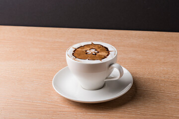 Mocha coffee with coffee beans on a wooden table