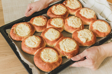 Vatrushka - pastries of ancient Slavic, Russian and Ukrainian cuisines made from butter yeast dough in the form of a small thick cake, in the middle of which there is a filling of cottage cheese.