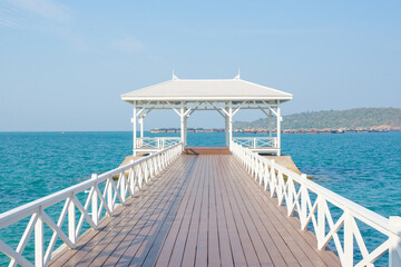 White gazebo with clear sea water