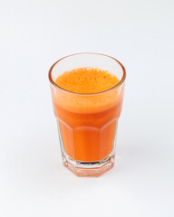 a glass of brand fresh juice on a white background