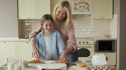 Mom with her daughter are cooking holiday pie in the kitchen, lifestyle photo series, hands . - Powered by Adobe