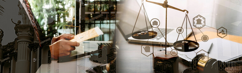 Justice and law concept.Male judge in a courtroom with the gavel, working with, computer and docking keyboard, eyeglasses, on table in morning light