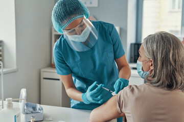 Female nurse in protective workwear 