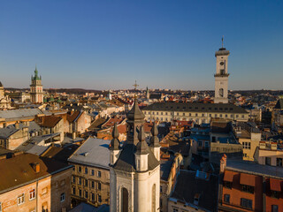 Fototapeta na wymiar aerial view of sunset above old european city. church bell tower