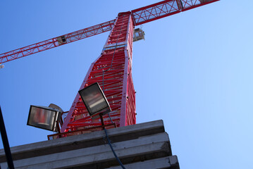 Huge red crane at construction site for skyscraper Franklinturm. Photo taken April 20th, 2021, Zurich, Switzerland.