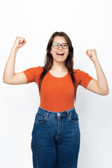 Vertical photo of an excited girl making the winner gesture.