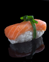 Delicious sushi nigiri with red fish on black background.Japan restaurant menu.Japanese food.