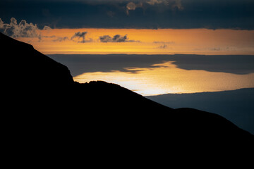 the sunrise over the Adriatic Sea seen from Monte Amaro. Trekking in the Majella national park, mountain range of the Apennines. Maiella mountain massif, Abruzzo, L'Aquila.