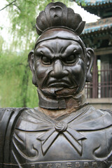 Fototapeta premium statue of a guardian (?) in the jinci monastery in taiyuan in china 