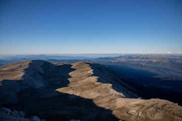 mountains with shadows at dawn. Trekking on Monte Amaro in the Majella National Park, the second highest peak in the Apennines. Maiella mountain massif, Abruzzo, L'Aquila.