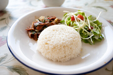 Stir fried Thai basil with Bacon and salad.
