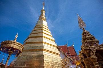 Fototapeta premium Beautiful golden Pagoda at Wat Phra That Cho Hae is a sacred ancient temple in Phrae, Thailand. Publie Domain.