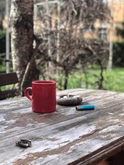 a cup of coffee on the wooden table