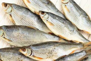 background of dry salted fish .roach lot view from above