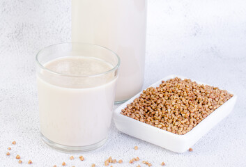 Buckwheat milk in a glass cup, close-up.