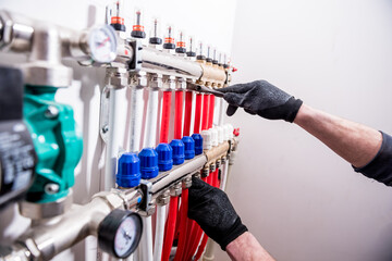 Pipefitter install system of underfloor heating system at home