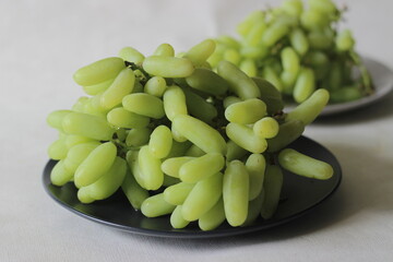 Indian variety of green seedless grapes with a long finger like shape