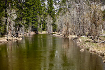 Fototapeta na wymiar Calm River in Mountain Valley