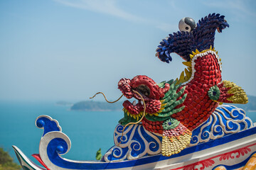 Colorful religious dragon fish sculpture