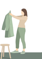 Middle aged woman choosing her coat at home with isolated background. Sustainable fashion concept 2021.