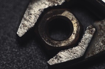 Wrench and rusty clamped nut