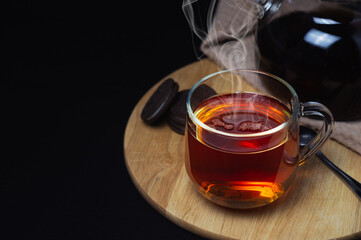 Black tea with cookies on the table