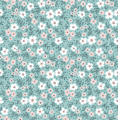 Cute seamless vector floral pattern. Endless print made of small white and pale pink flowers. Summer and spring motifs. Light blue background. Stock vector illustration.