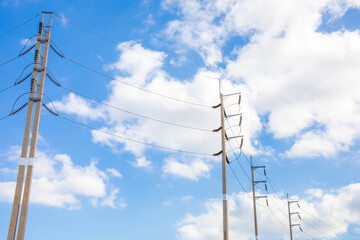 Electric wire and pole and blue sky.