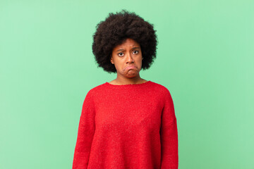 afro black woman feeling sad and whiney with an unhappy look, crying with a negative and frustrated...