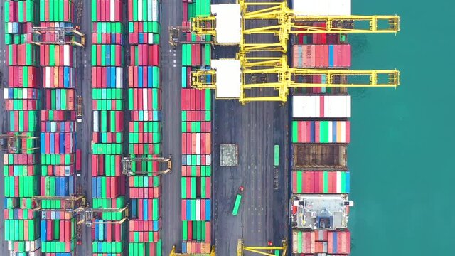 Aerial top view of international containers cargo ship at industrial import-export port transport goods around world, global transportation and logistic business.Oversea international Business.