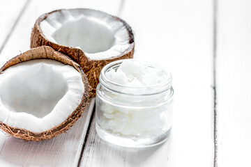 coconut oil for body care in cosmetic concept on white desk mock up
