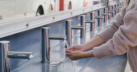 Woman wash hand at outdoor