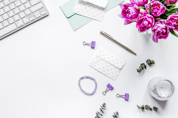 Trendy design of workdesk with blossom on white background top view mock-up