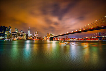 Fototapeta na wymiar Manhattan, Brooklyn Bridge, and Manhattan Bridge, New York, at Night