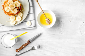 cooked pancake on plate top view at wooden background