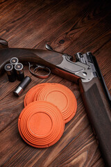 Clay target plates for shooting with rifle on wooden back