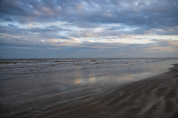 Beach, ocean, blue sky with clouds pano