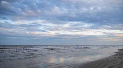 Fototapeta na wymiar Beach, ocean, blue sky with clouds pano