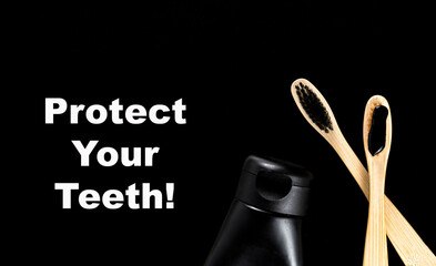 Group of eco bamboo toothbrushes, on black background.