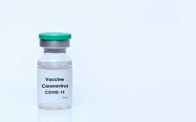 Vial with a vaccine on a white background.The concept of medicine, healthcare and science.Coronavirus vaccine.Copy space for text..