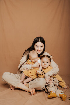 mother and her two children at a photo shoot in the studio