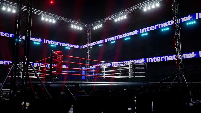 Empty boxing arena in the light of a spotlight 4k video. High quality 4k footage