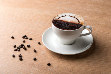 Cappuccino coffee on a wooden table