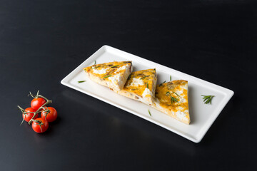 Garlic cheese toast on white plate 