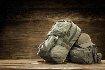 Backpack on desk and wall with free space for your decoration 