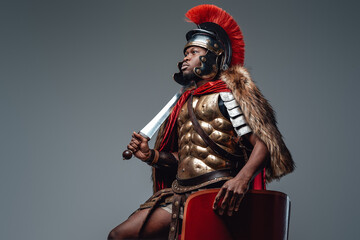 Roman warrior with pelt wielding sword and shield