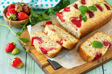 Delicious summer dessert gluten free strawberry pie, cake with strawberries on a wooden table.